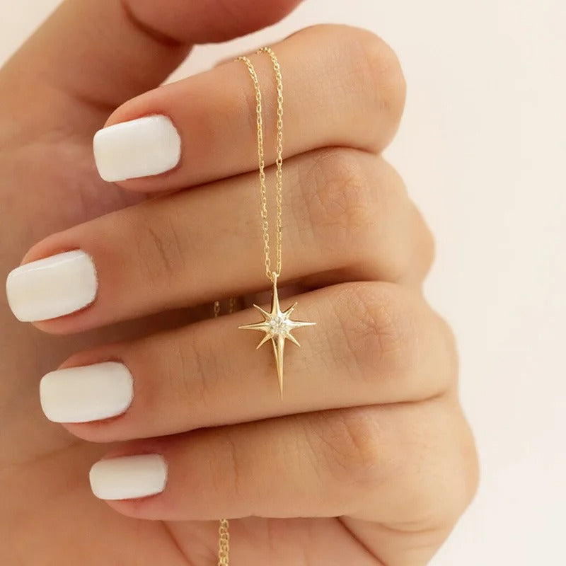 ASTREA – Collana in Acciaio Anallergico placcato oro 18K con  stella a 8 punte e zircone centrale